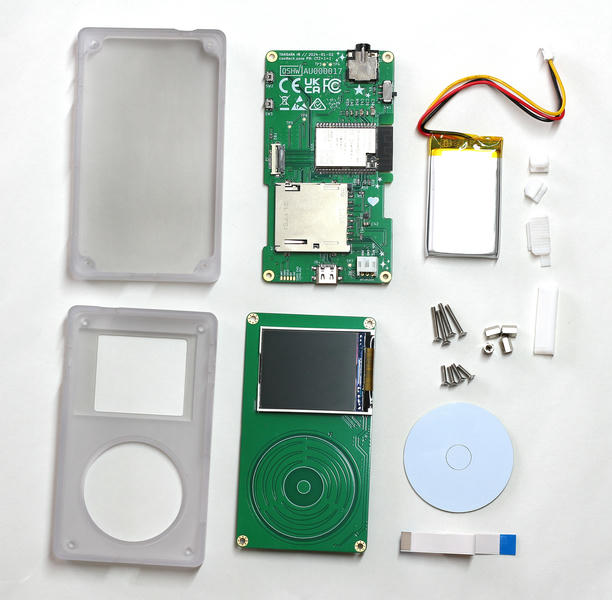 Every component that makes a single Tangara, laid out messily on a desk